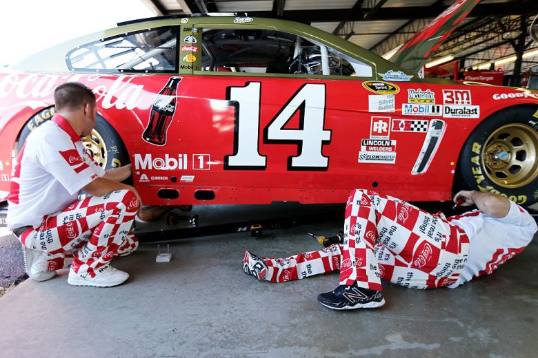 Tony Stewart's throwback car and his pit crew's throwback uniforms