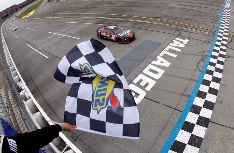Kyle Busch crosses the start/finish line
