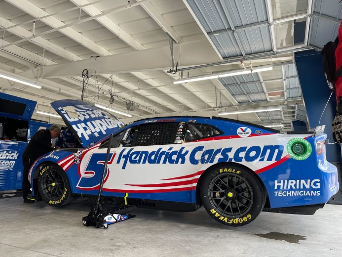 Kyle Larson's car gets attended to in the garage following a Stage 1 wreck at Dover Motor Speedway.