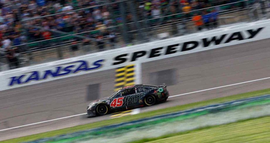 No. 45 23XI Racing Toyota crosses start/finish line at Kansas Speedway.