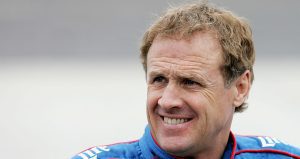 Rusty Wallace looks on.