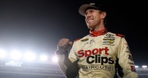 Carl Edwards looks on.