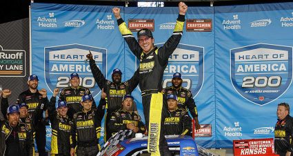 Grant Enfinger celebrates with his No. 23 team in Victory Lane at Kansas Speedway
