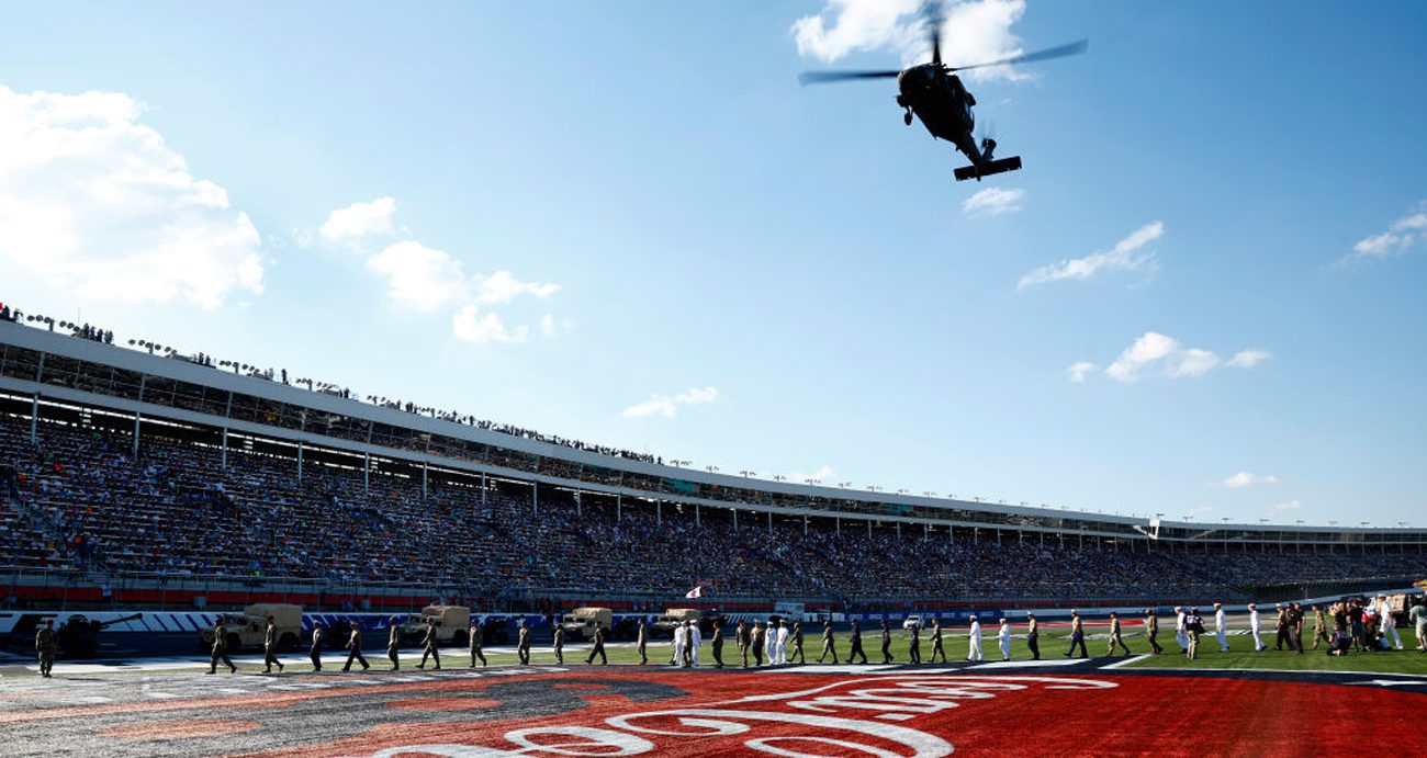A helicopter flies over Charlotte Motor Speedway during pre-race ceremonies for the 2022 Coca-Cola 600.