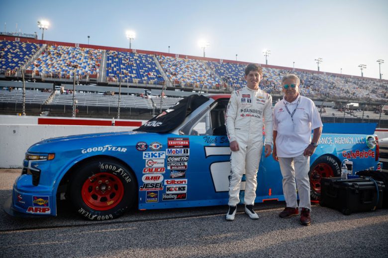 Nick Sanchez and Mario Andretti pose for a photo
