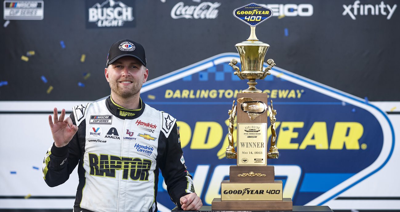 William Byron poses with trophy at Darlington Raceway.