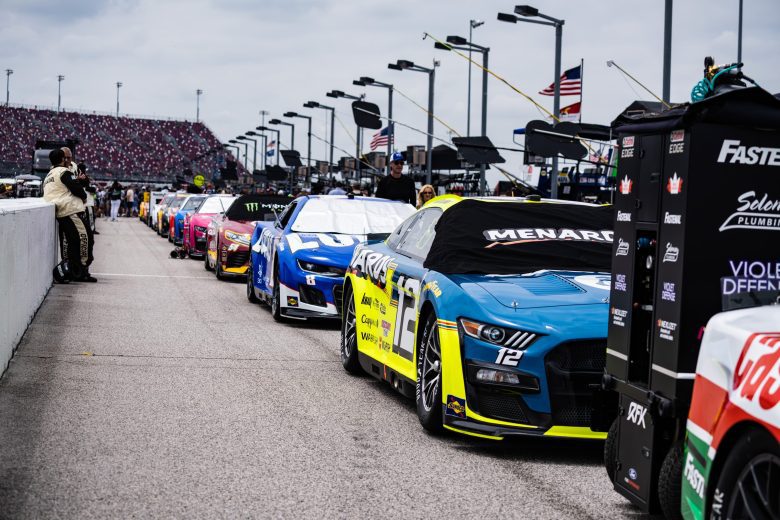 NASCAR Cup Series cars line pit road before the Goodyear 400 at Darlington Raceway.