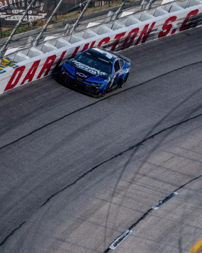 Kyle Larson rides the wall at Darlington Raceway.