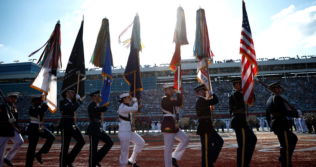 Military members perform pre-race ceremonies.