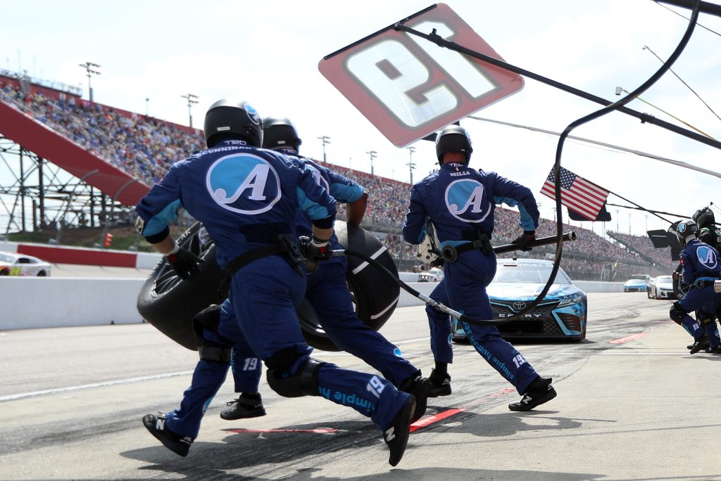 Martin Truex Jr.'s pit crew prepares to pit the No. 19 Toyota