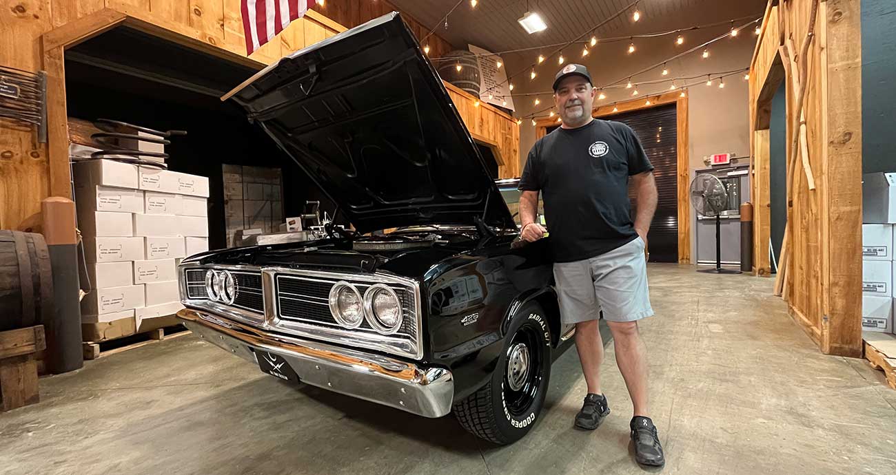 Moonshine maker Brian Call and a sinister moonshine car at Call Family Distillers.