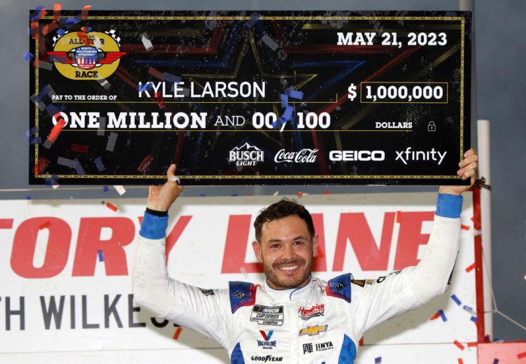 Kyle Larson poses with All-Star check