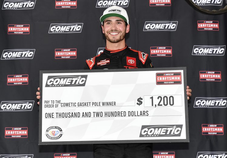 CONCORD, NORTH CAROLINA - MAY 26: Tanner Gray, driver of the #15 Black's Tire Toyota, poses with the pole award after posting the fastest time during qualifying for the NASCAR Craftsman Truck Series North Carolina Education Lottery 200 at Charlotte Motor Speedway on May 26, 2023 in Concord, North Carolina. (Photo by Logan Riely/Getty Images)