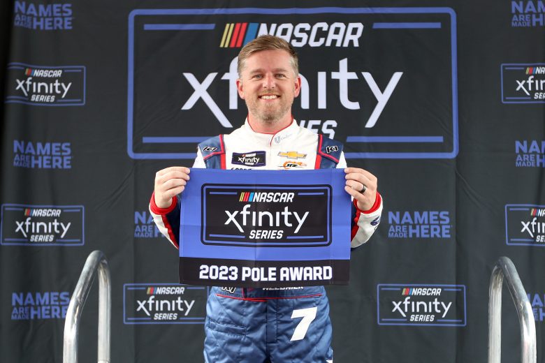 CONCORD, NORTH CAROLINA - MAY 26: Justin Allgaier, driver of the #7 Unilever Military DeCA RCPT Chevrolet, poses with the pole award after posting the fastest time during qualifying for the NASCAR Xfinity Series Alsco Uniforms 300 at Charlotte Motor Speedway on May 26, 2023 in Concord, North Carolina. (Photo by David Jensen/Getty Images)