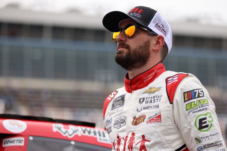 CONCORD, NORTH CAROLINA - MAY 26: Jeremy Clements, driver of the #51 The Masonic Home for Children Chevrolet, stands on the grid during qualifying for the NASCAR Xfinity Series Alsco Uniforms 300 at Charlotte Motor Speedway on May 26, 2023 in Concord, North Carolina. (Photo by David Jensen/Getty Images)
