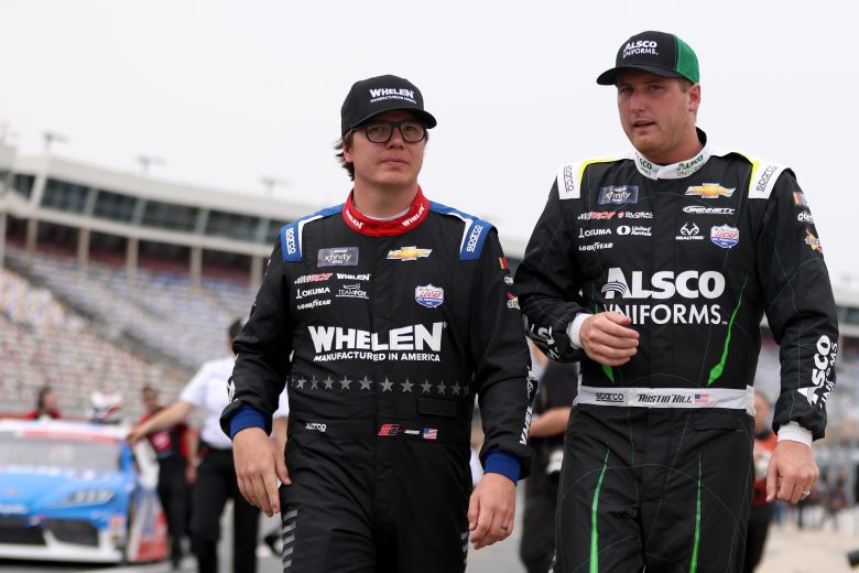 CONCORD, NORTH CAROLINA - MAY 26: Sheldon Creed, driver of the #2 Whelen Chevrolet, and Austin Hill, driver of the #21 Alsco Chevrolet, walk the grid during qualifying for the NASCAR Xfinity Series Alsco Uniforms 300 at Charlotte Motor Speedway on May 26, 2023 in Concord, North Carolina. (Photo by David Jensen/Getty Images)