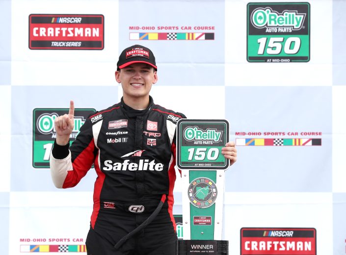 Corey Heim poses in Victory Lane at Mid-Ohio