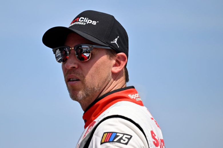 Denny Hamlin looks on.