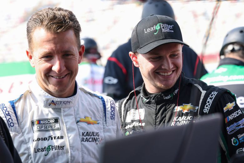 AJ Allmendinger and Justin Haley look on