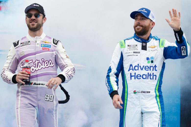 Daniel Suárez and Ross Chastain wave to the fans