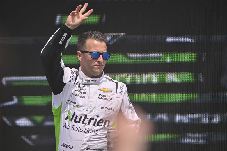 AUSTIN, TEXAS - MARCH 26: AJ Allmendinger, driver of the #16 Farmsmart Chevrolet, waves to fans as he walks onstage during driver intros prior to the NASCAR Cup Series EchoPark Automotive Grand Prix at Circuit of The Americas on March 26, 2023 in Austin, Texas. (Photo by Logan Riely/Getty Images)