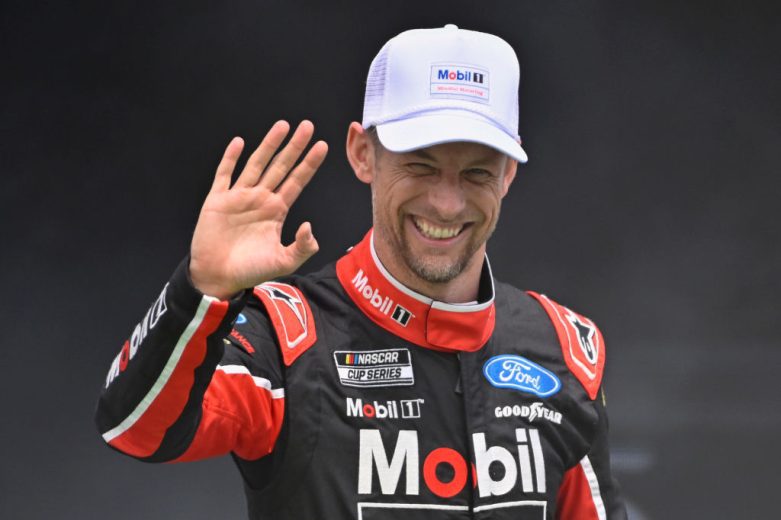 Jenson Button waves to fans