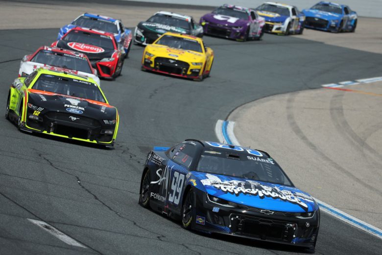 Daniel Suárez leads a pack of NASCAR Cup Series cars at New Hampshire Motor Speedway.