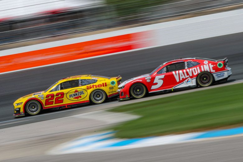 Joey Logano and Kyle Larson race at New Hampshire Motor Speedway.