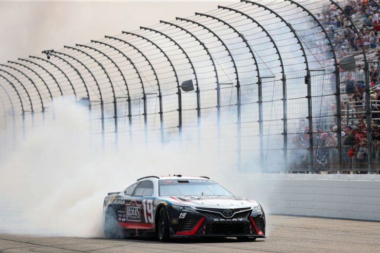 Martin Truex Jr. does a victory burnout at New Hampshire Motor Speedway.