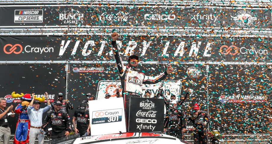 Martin Truex Jr. celebrates in Victory Lane at New Hampshire Motor Speedway.
