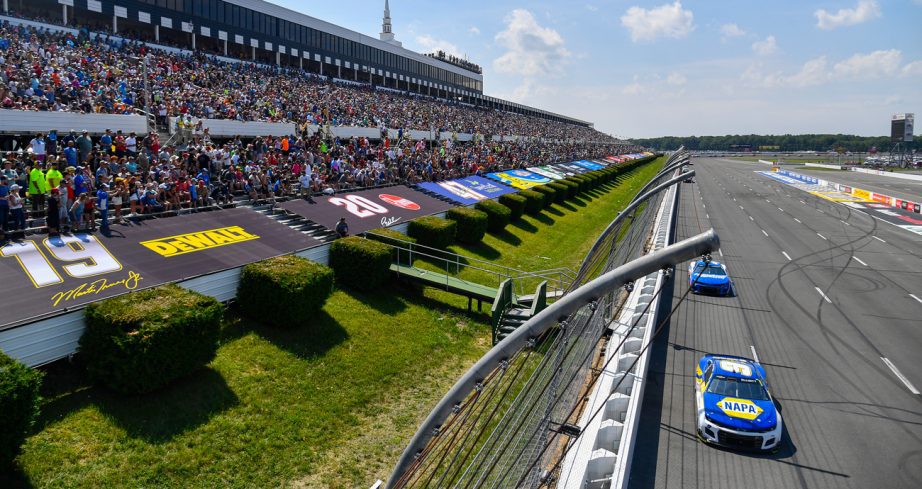 NASCAR Cup Series cars race at Pocono Raceway.