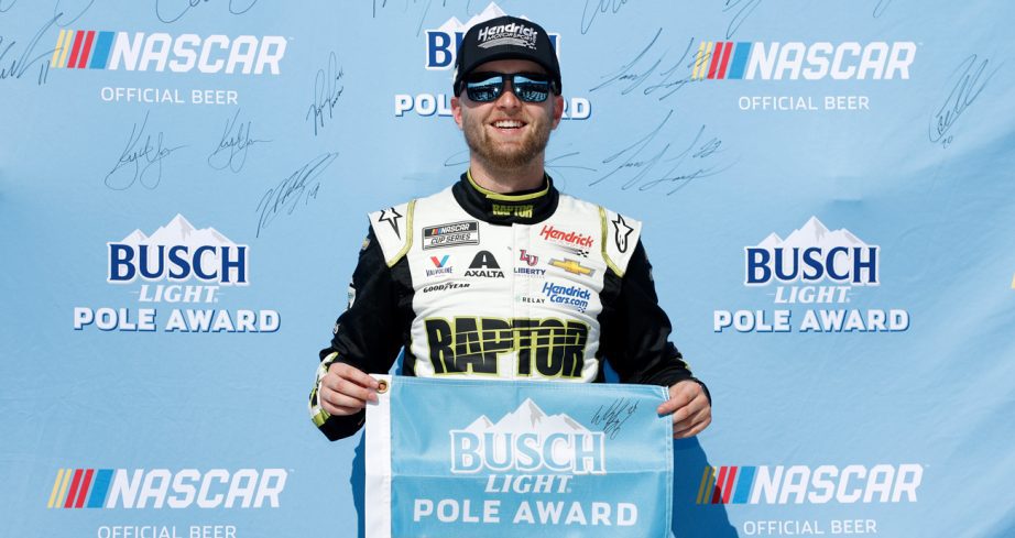 William Byron poses for a photo after winning the Busch Light Pole Award at Pocono Raceway.