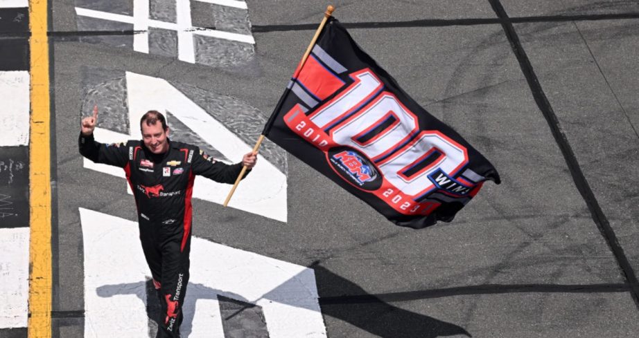 Kyle Busch waves KBM flag following his Truck Series win at Pocono.