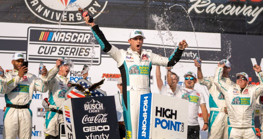 Denny Hamlin celebrates win at Pocono Raceway.