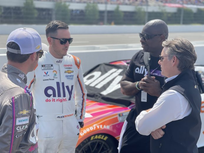 Alex Bowman talks with Jeff Gordon at Pocono Raceway.