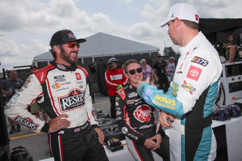 From left, Martin Truex Jr., Christopher Bell and Denny Hamlin talk on pit road
