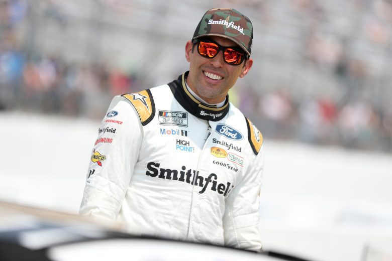 Aric Almirola smiles on pit road