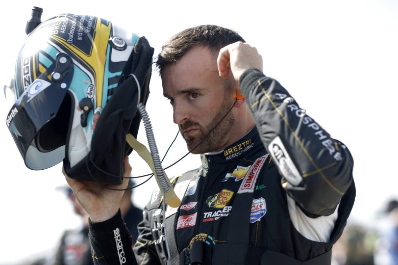 Austin Dillon puts on his helmet