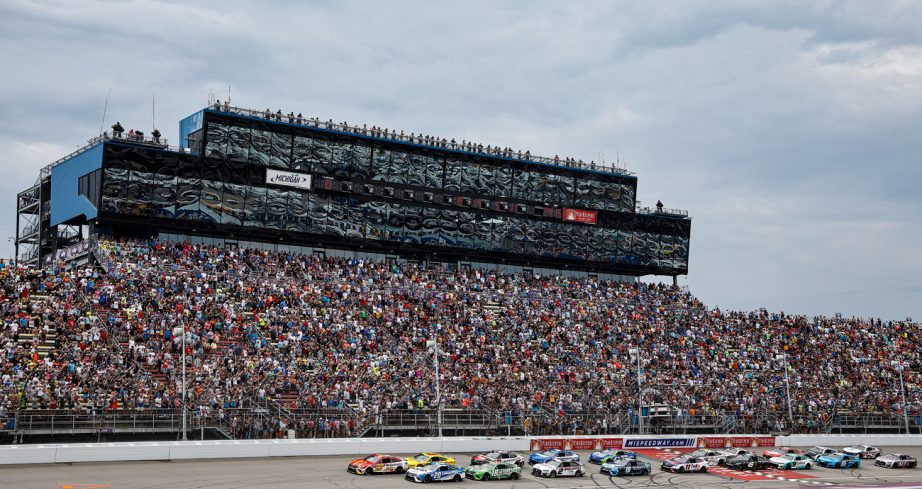 NASCAR Cup Series cars race at Michigan International Speedway.