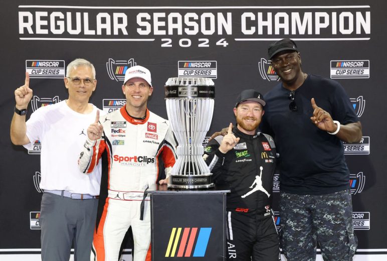 Tyler Reddick poses for a photo with Michael Jordan (R) and Denny Hamlin (L) after winning the Regular Season Championship.