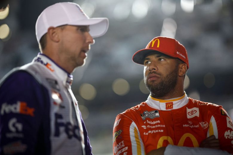 Denny Hamlin (L) and Bubba Wallace (R) talk.