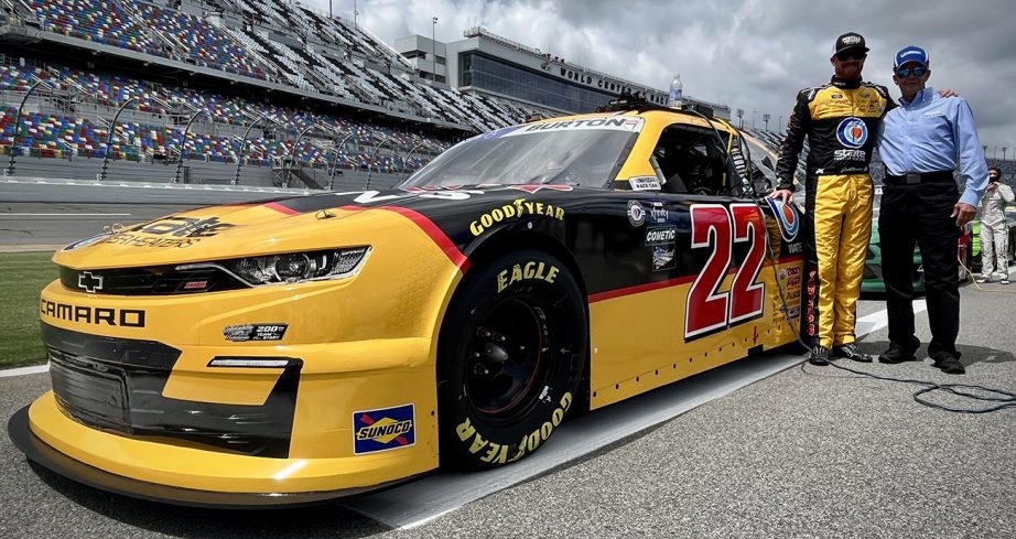 Jeb Burton poses with his throwback car