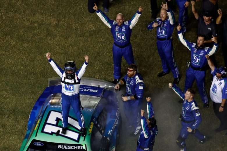 Chris Buescher celebrates with his team.