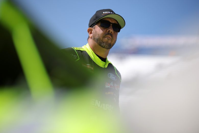 Matt Crafton stands next to his truck
