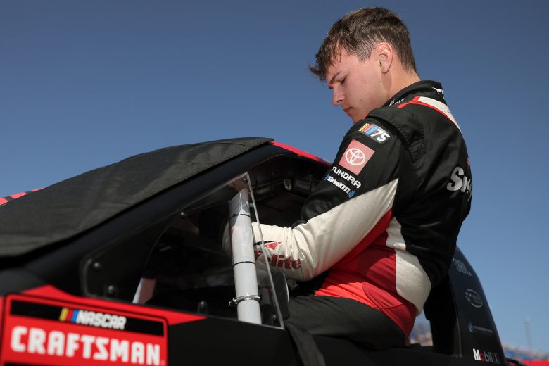 Corey Heim climbs into his truck