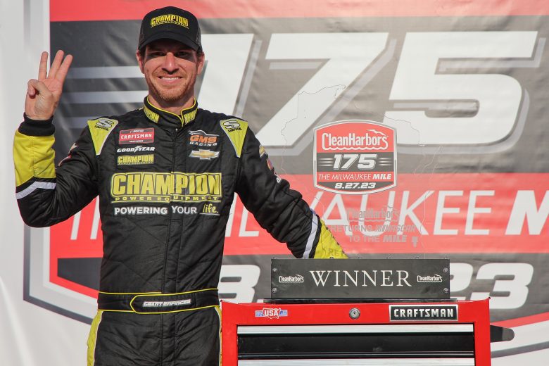 Grant Enfinger poses in Victory Lane at Milwaukee