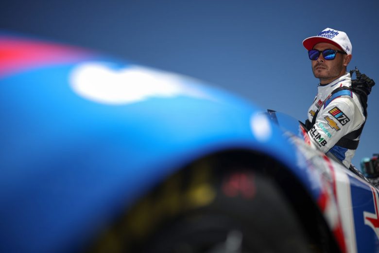 Larson climbs in his race car