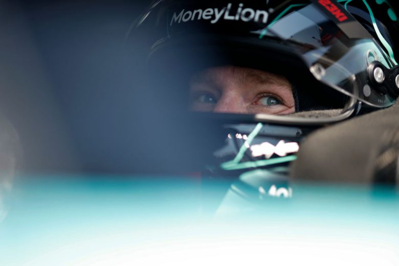 Tyler Reddick looks on.