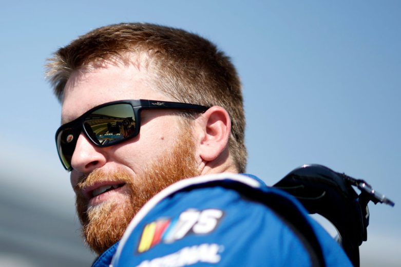 Chris Buescher looks on.