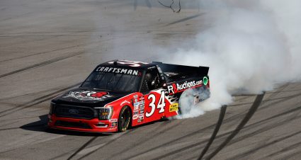 Brett Moffitt performs a burnout in the black and red No. 34 Ford truck after winning at Talladega